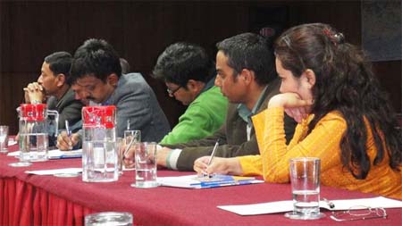 Participants listen during a roundtable with Dr. Dinesh Srivastava 
